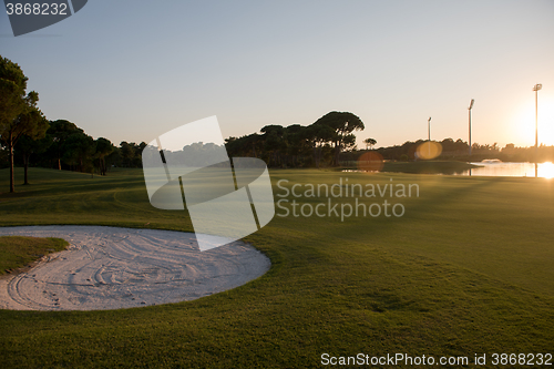 Image of golf course on sunset