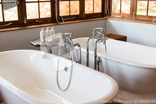 Image of close up of bathroom with two bathtubs