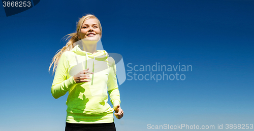 Image of woman jogging outdoors