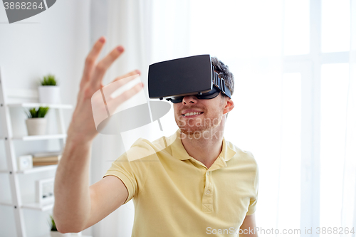 Image of young man in virtual reality headset or 3d glasses