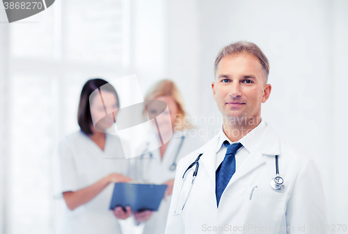 Image of male doctor with colleagues