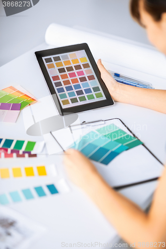 Image of woman working with color samples for selection