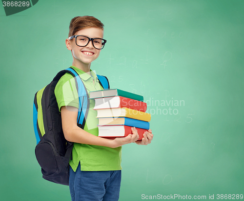 Image of happy student boy with school bag and books