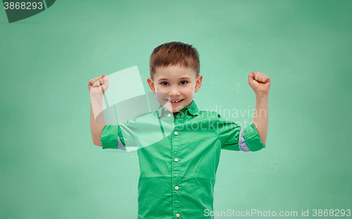 Image of happy smiling little boy with raised hand