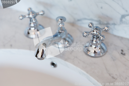 Image of close up of bath tap or faucet at bathroom