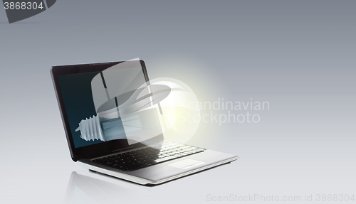 Image of laptop computer with light bulb