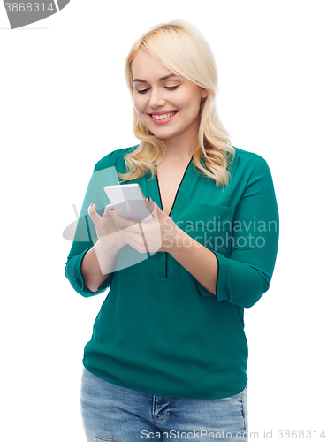 Image of happy woman with smartphone texting message