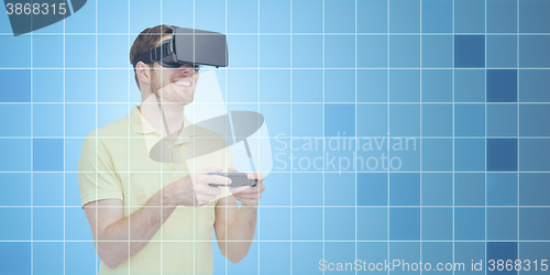 Image of happy man in virtual reality headset with gamepad