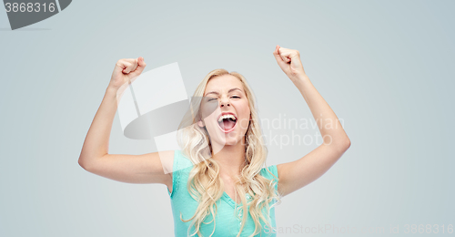 Image of happy young woman or teen girl celebrating victory