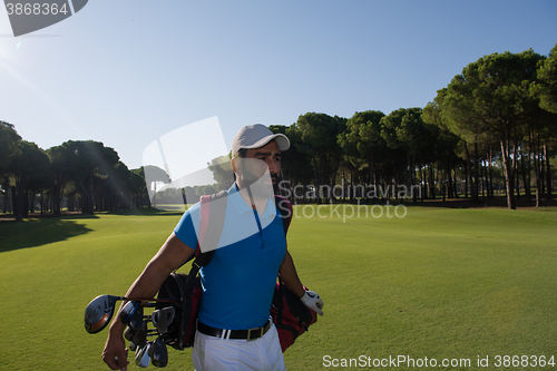 Image of golf player walking