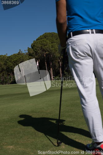 Image of golf player portrait from back