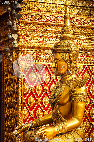 Image of Gold sitting Buddha statue in Thailand