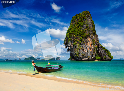 Image of Long tail boat on beach, Thailand