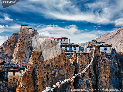 Image of Dhankar gompa Tibetan Buddhist monastery and prayer flags lungta