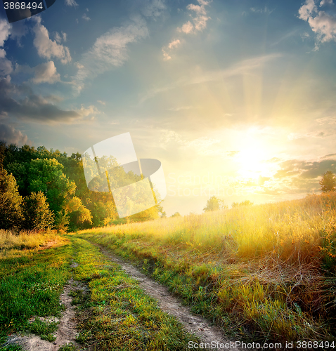 Image of Sunbeams and country road