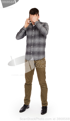 Image of Caucasian man on the phone - confusing phone call