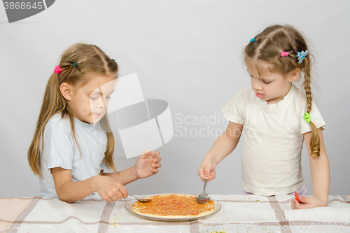 Image of Two little sisters concentrated smear sauce based pizza