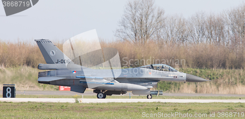 Image of LEEUWARDEN, NETHERLANDS - APRIL 11, 2016: A dutch F-16 on the gr