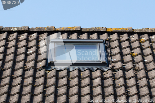 Image of Dormer on a black tiled roof