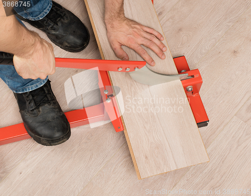 Image of Red tool for cutting laminate