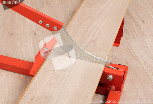 Image of Red tool for cutting laminate