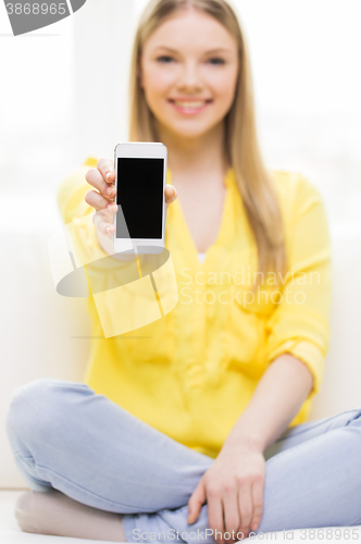 Image of close up of woman showing smartphone blank screen