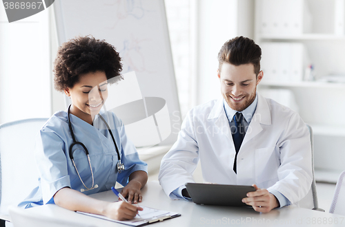 Image of two happy doctors meeting at hospital office