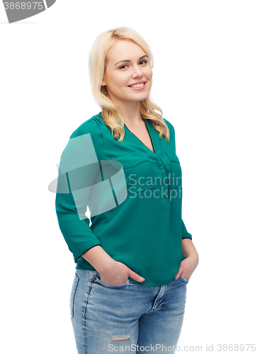 Image of smiling young woman in shirt and jeans