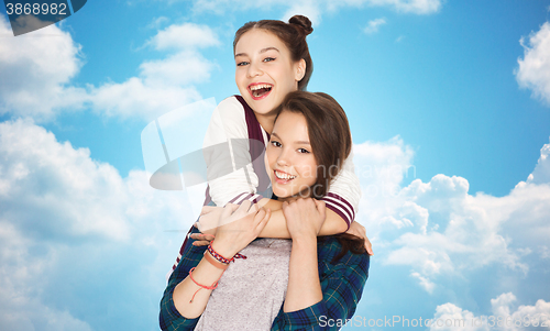 Image of happy smiling pretty teenage girls hugging