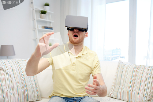 Image of young man in virtual reality headset or 3d glasses