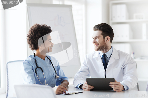 Image of two happy doctors meeting at hospital office