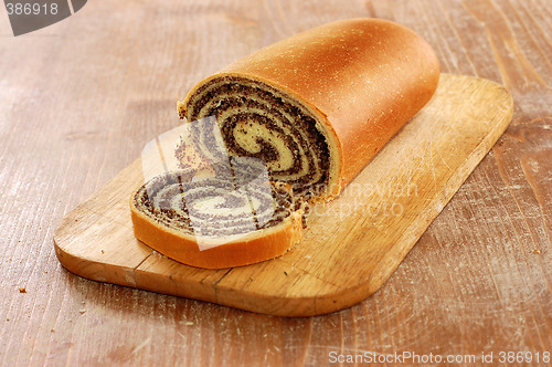 Image of still life of poppy bread loaf in kitchen