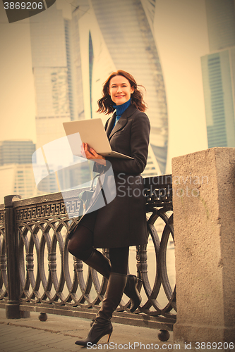 Image of middle-aged woman in a dark coat