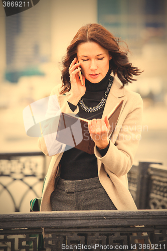 Image of business woman talking on a cell phone