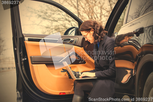 Image of woman with a laptop