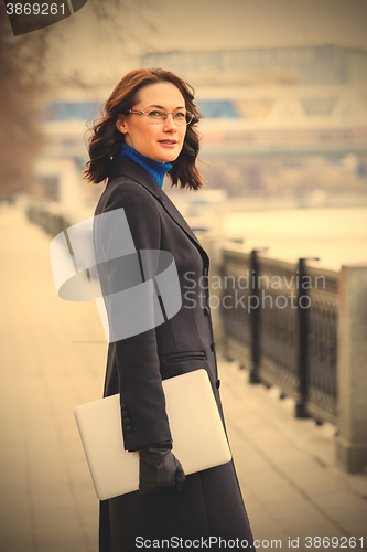 Image of business middle-aged woman