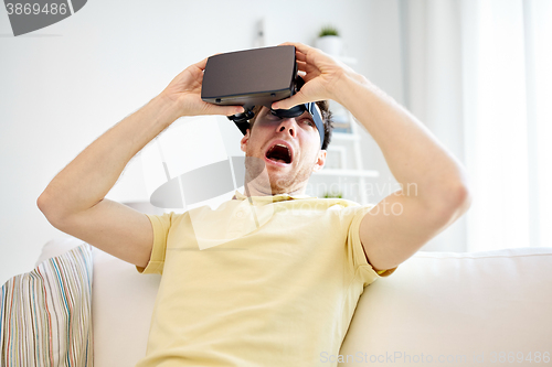 Image of young man in virtual reality headset or 3d glasses