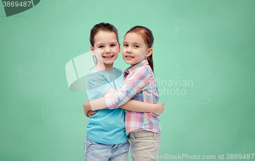 Image of happy smiling little girls hugging