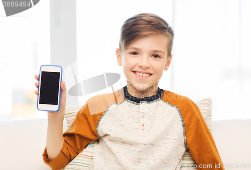 Image of smiling boy with smartphone at home