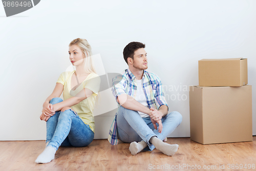 Image of unhappy couple having argument at home