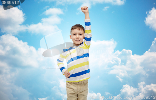 Image of happy smiling little boy with raised hand