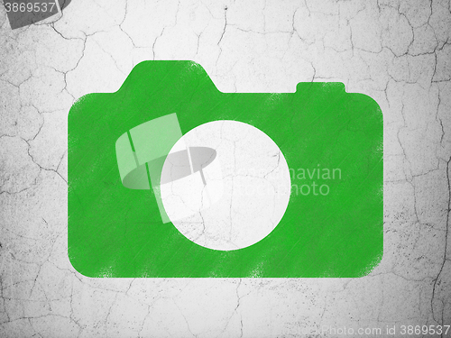 Image of Vacation concept: Photo Camera on wall background