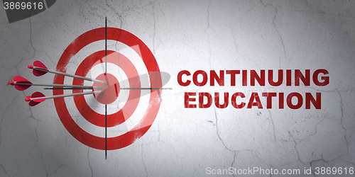 Image of Education concept: target and Continuing Education on wall background