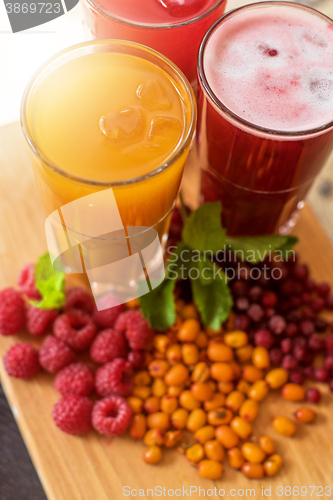 Image of fruit drink with cranberries raspberries and sea buckthorn