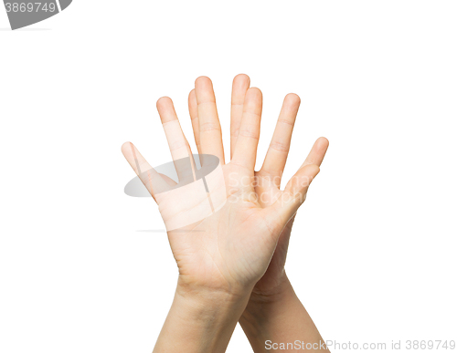 Image of close up of two hands showing five fingers