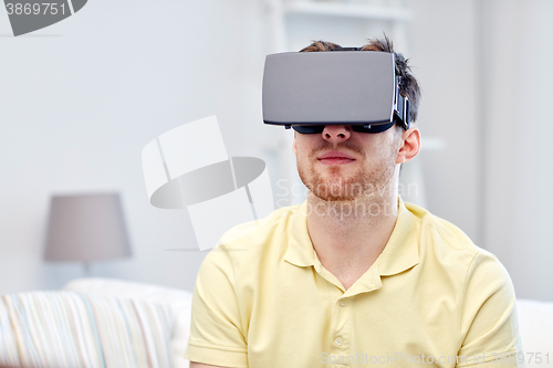 Image of young man in virtual reality headset or 3d glasses