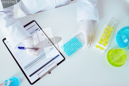 Image of close up of scientist making test in lab