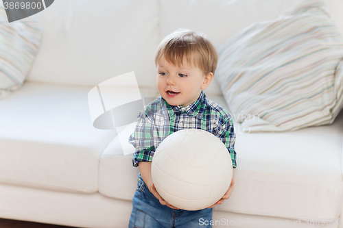 Image of happy little baby boy with ball at home