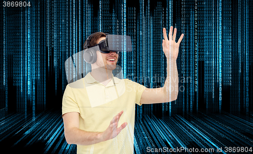 Image of happy man in virtual reality headset or 3d glasses