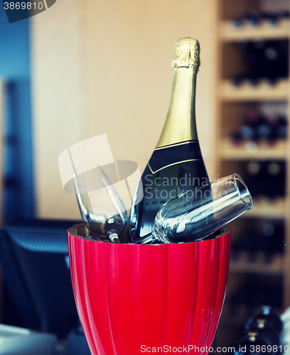 Image of close up of champagne and glasses at restaurant